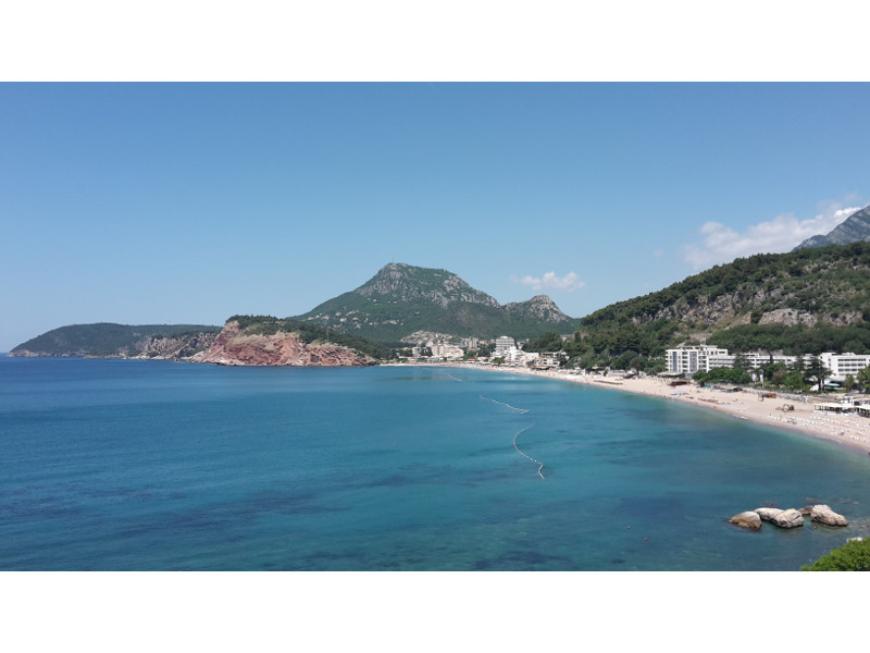The whole beach and bay of Sutomore. View from the MONTERAMA apartment house in June 2017.